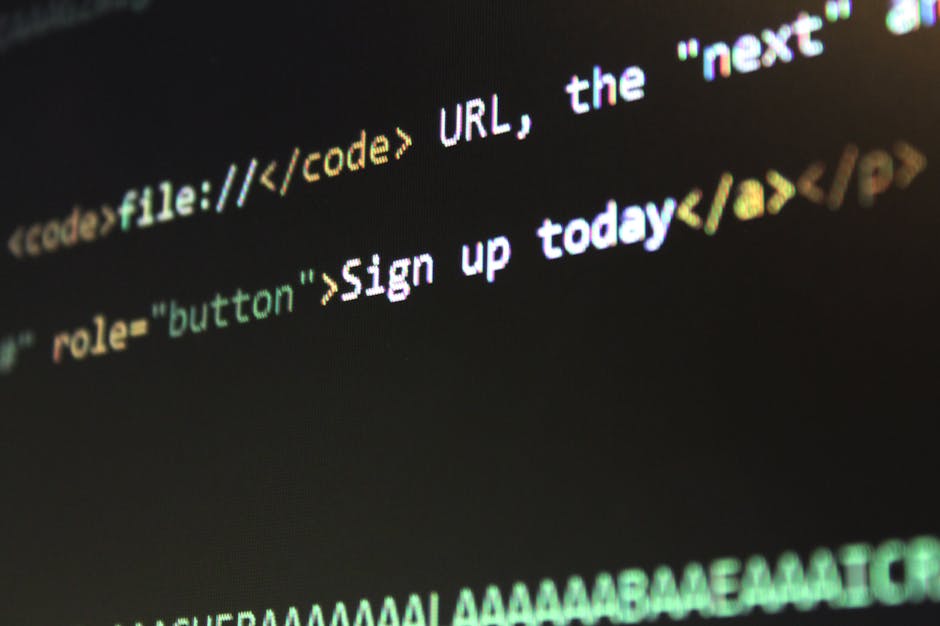 Close-up of a computer screen displaying HTML code with the phrase 'Sign up today' highlighted within the code, featuring lines of colourful syntax highlighting on a dark background. The image emphasi